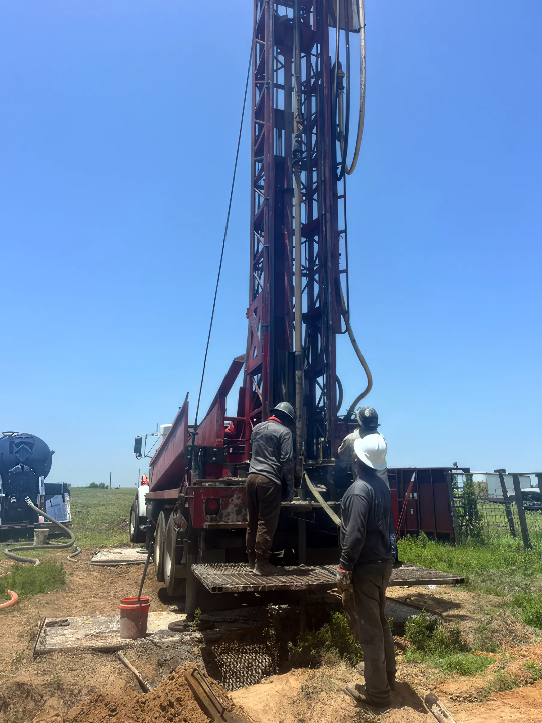 DFW Well Service crew running a water well drilling rig near Corsicana, TX